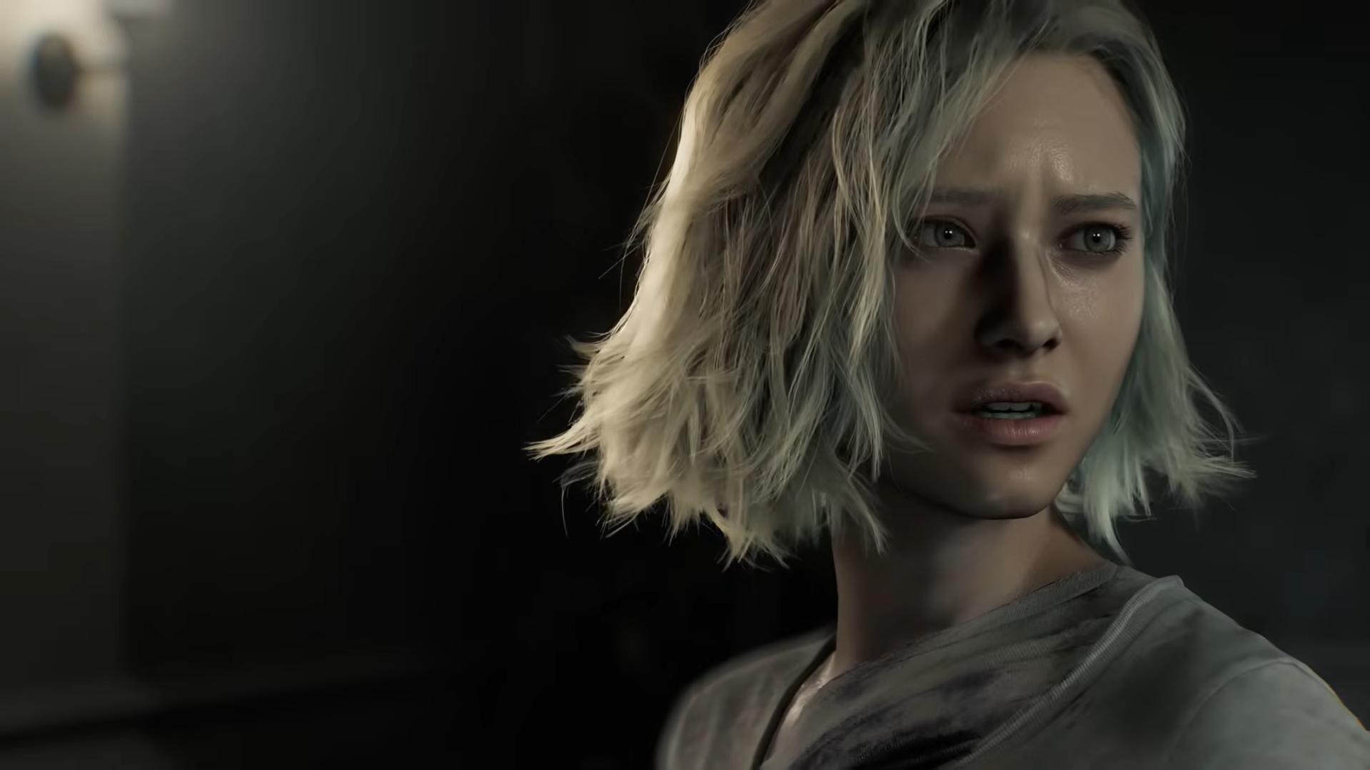 Grace Ashcroft, the new playable protagonist in Resident Evil Requiem, looking directly forward in a cinematic close-up from Capcom's 2026 survival horror game